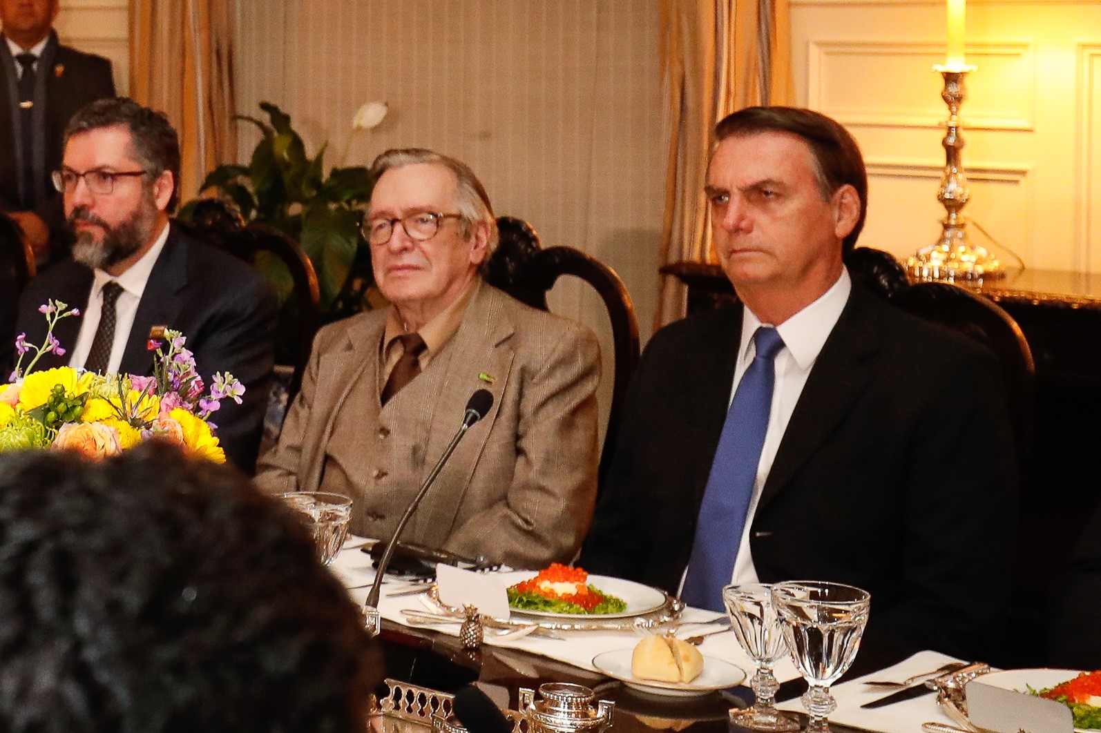 Former head of the Brazilian Ministry of Foreign Affairs, Ernesto Araújo (left), Olavo de Carvalho (center), and Brazilian President Jair Bolsonaro (right).