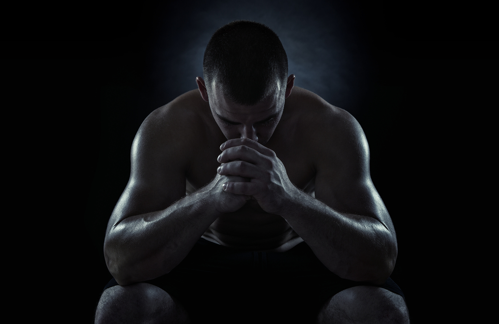Close up of young sportsman focusing before the game isolated on