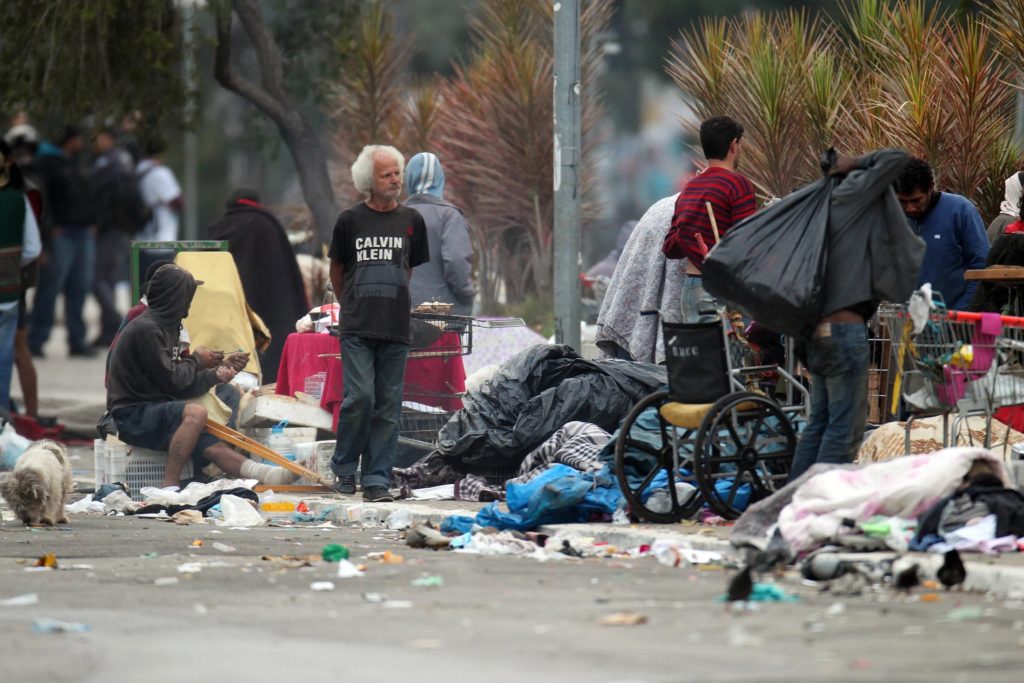Life inside this square is as intense as it is dramatic. People lie on mattresses, make bonfires, rummage through garbage, and take drugs.