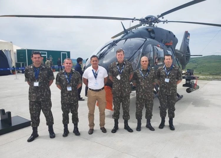 Brigadier General Ricardo Nigri (center) and his staff pose with the H-145M in Romania.