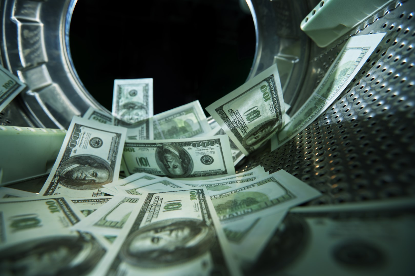 Washing banknotes in machine, money laundering, financial fraud