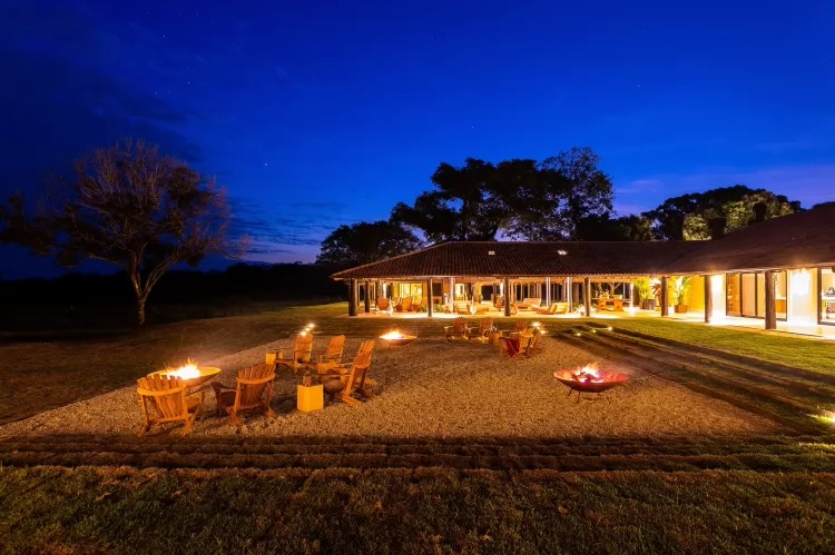 The outdoor area with a fire pit is the best place to warm up and enjoy the starry Pantanal sky.