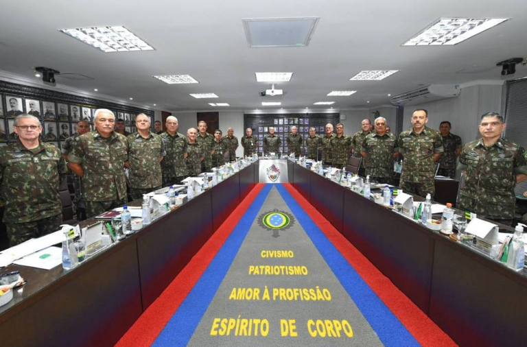 “Bunch of cowards,” say banners about generals in Brasilia