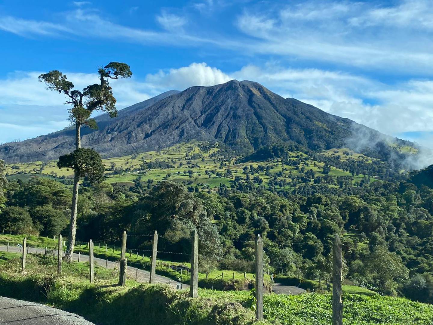 Turrialba Volcano above green pastures and farmland in Cartago province, Costa Rica