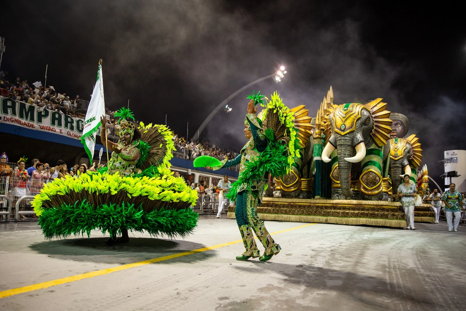 Master of ceremonies and flag bearer of a samba school at the São Paulo Sambadrome at night