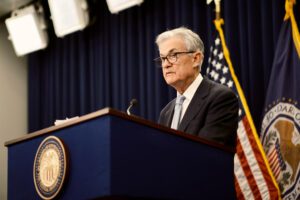 Fed Hints at Delayed Rate Cuts Amid Inflation Challenges