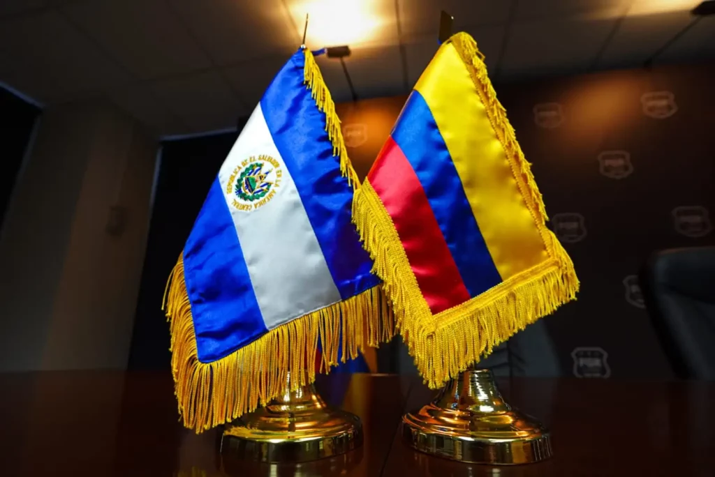 Colombian and El Salvador flags on a table