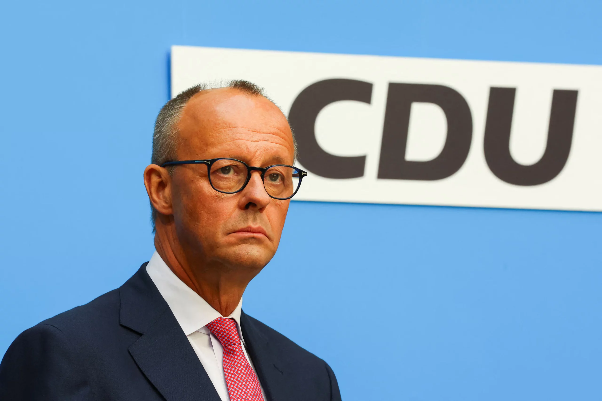 Close-up of Friedrich Merz in front of a CDU party backdrop