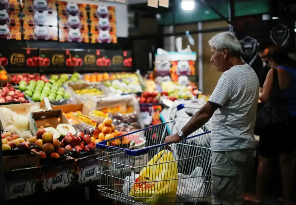 Man with shopping cart in a grocery store
