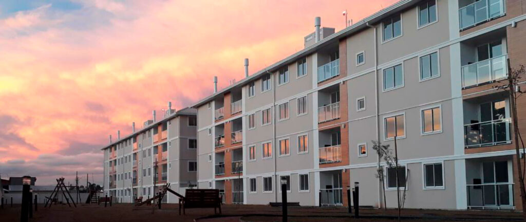 Apartment buildings at sunset with playground