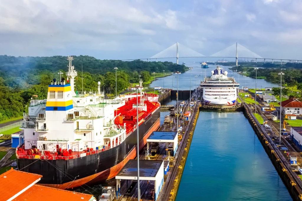 Ships in Panama Canal locks with bridge