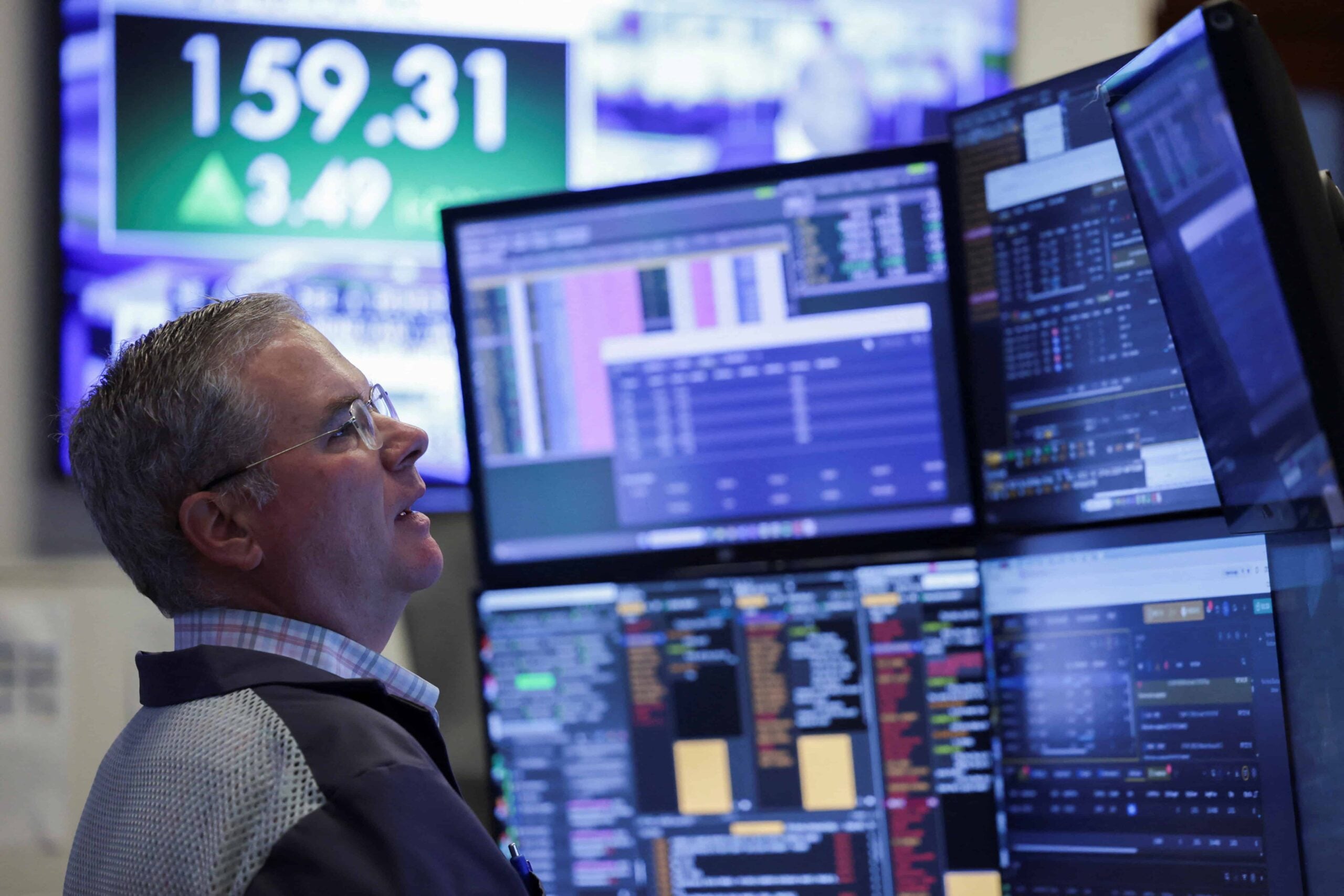 A trader on a stock exchange floor as the weak-dollar trade into Latin America loses steam