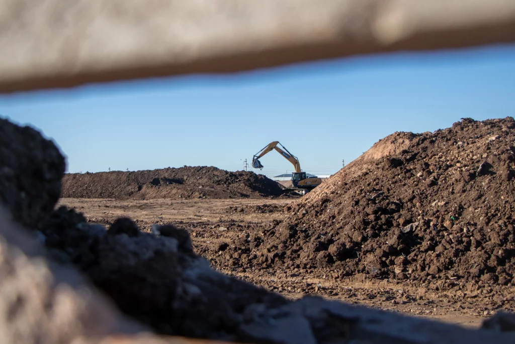 Excavator moving dirt on a construction site