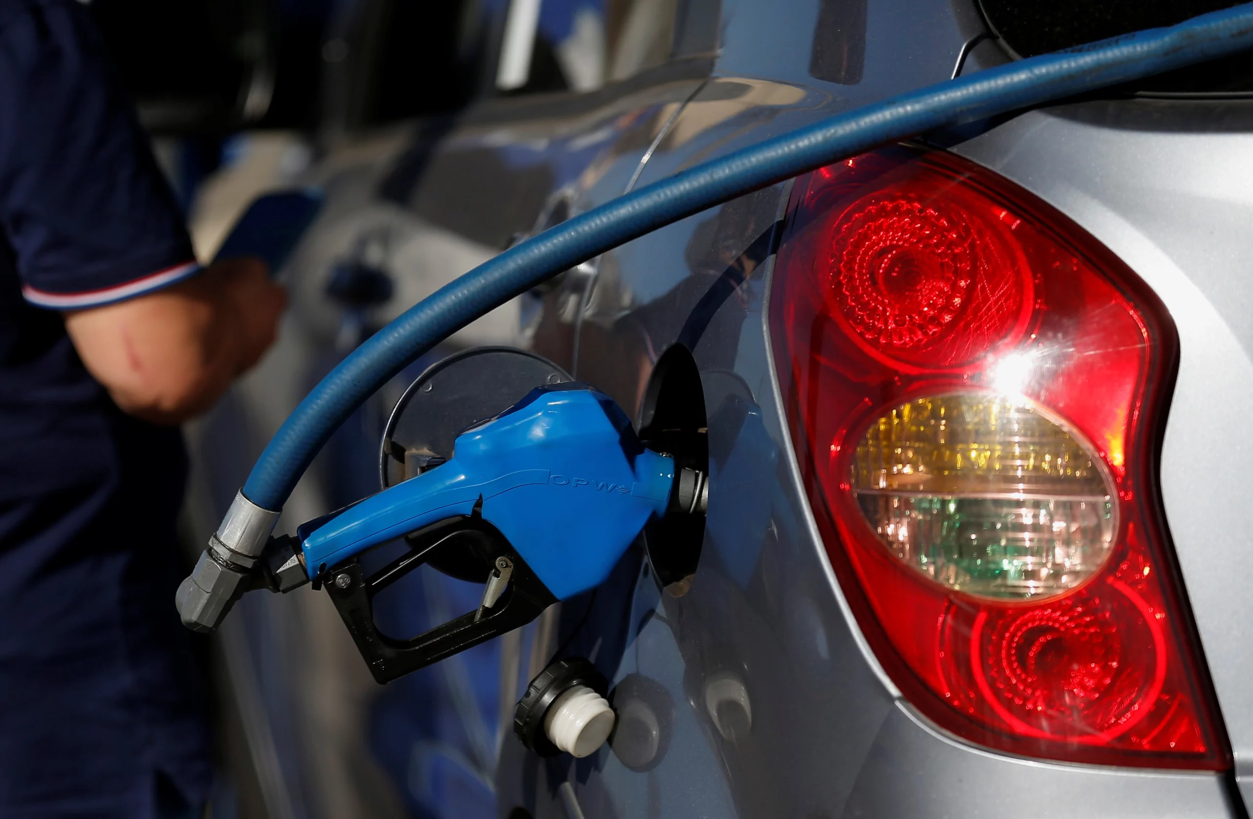 Electric cars charging at a station in Chile as fuel prices push drivers toward electric vehicles