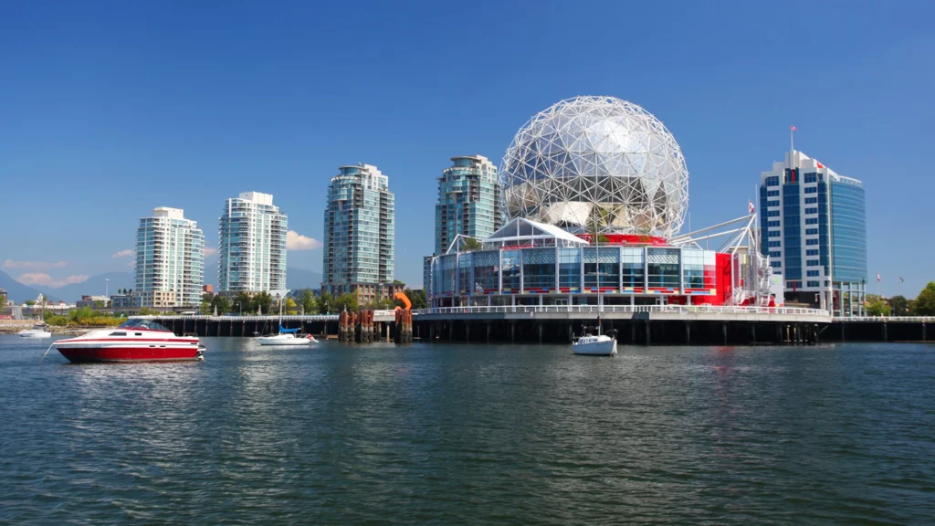 Vancouver cityscape with Science World and boats on water