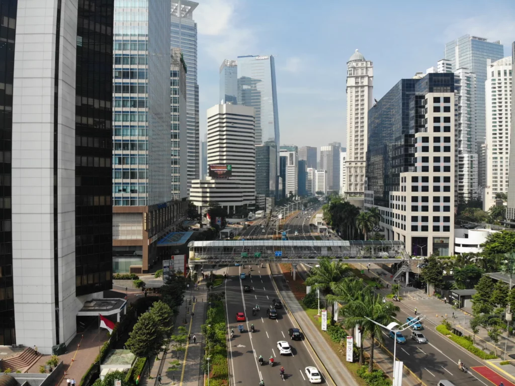 Modern city skyline with skyscrapers and a busy highway