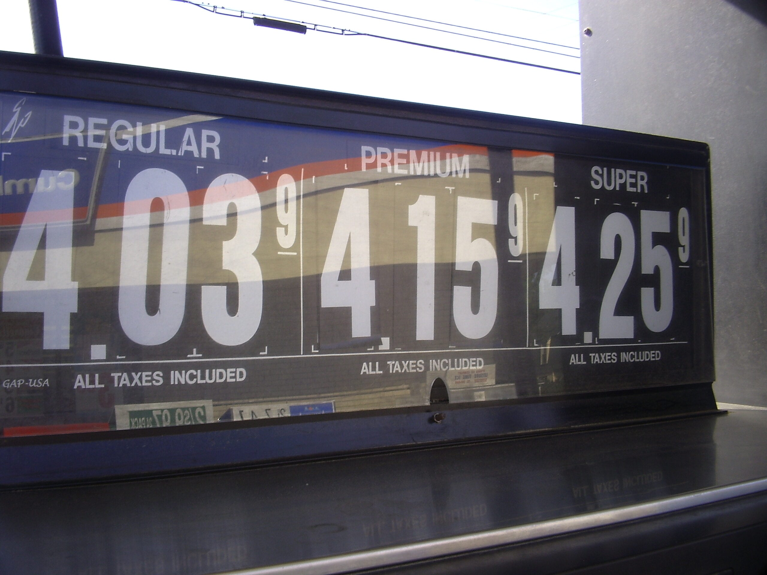 energy inflation — fuel prices on a gas-station sign