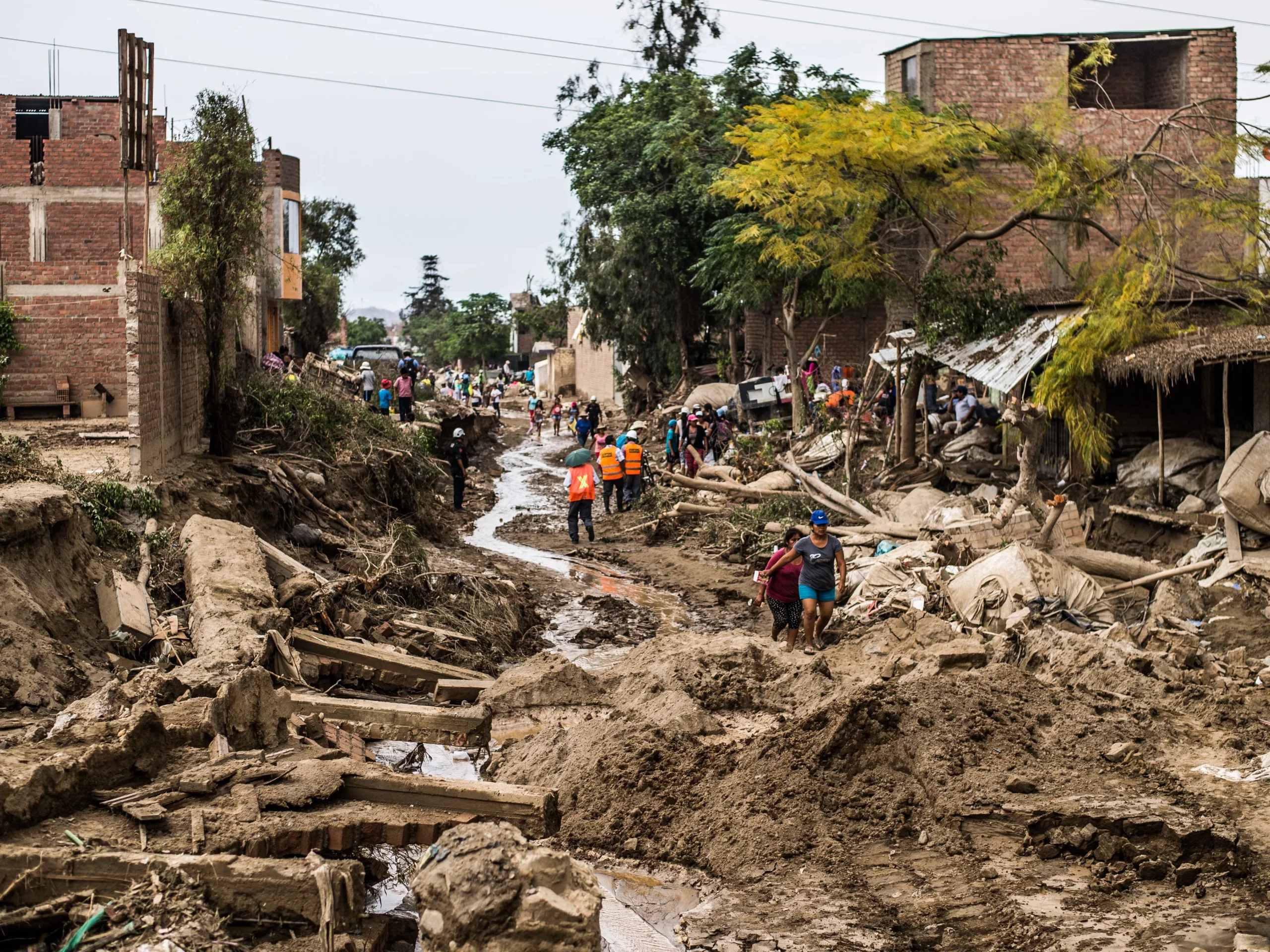 Debris and mud cleared from a Peruvian street after flooding, illustrating El Nino preparations