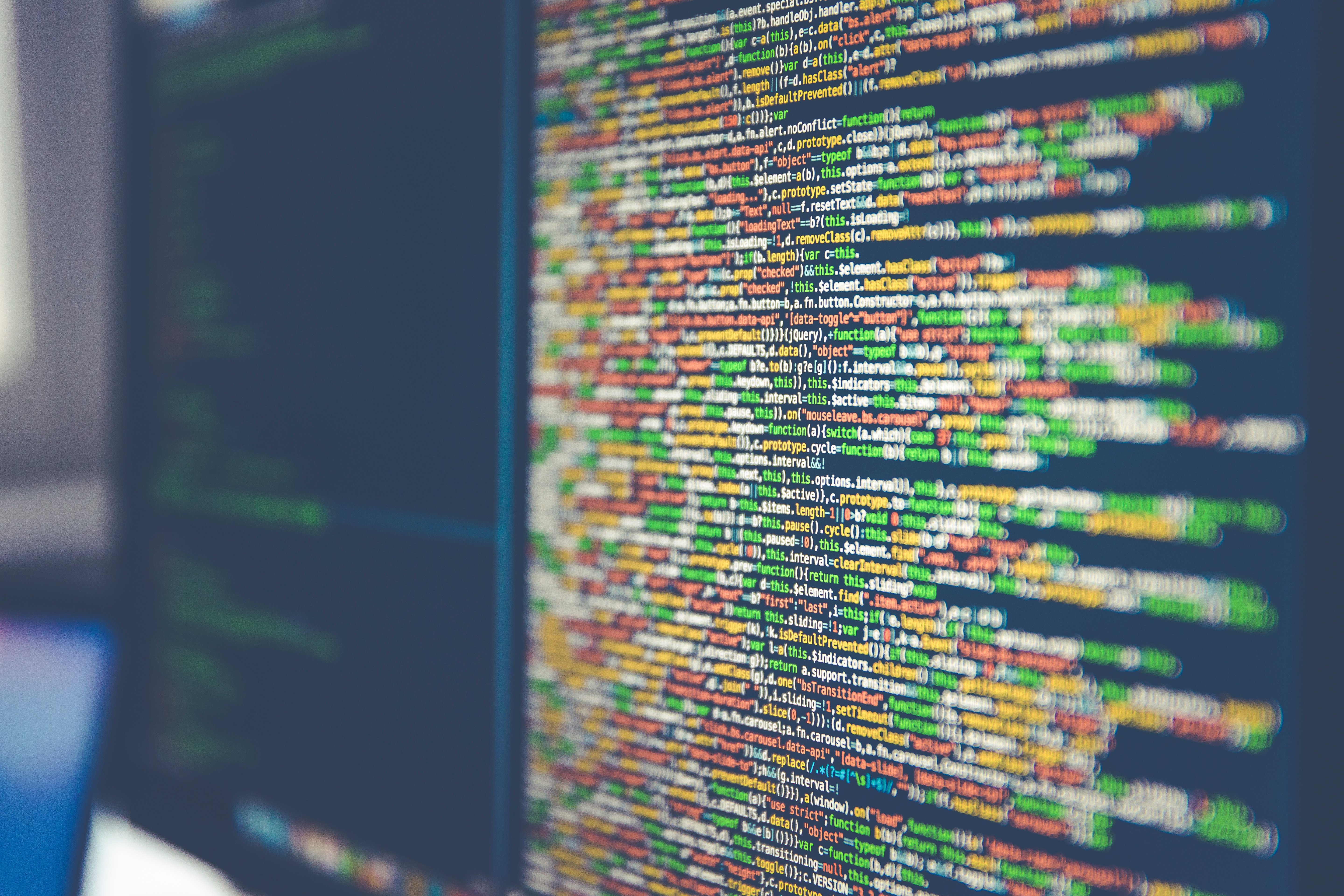 Software code on a monitor in a development office