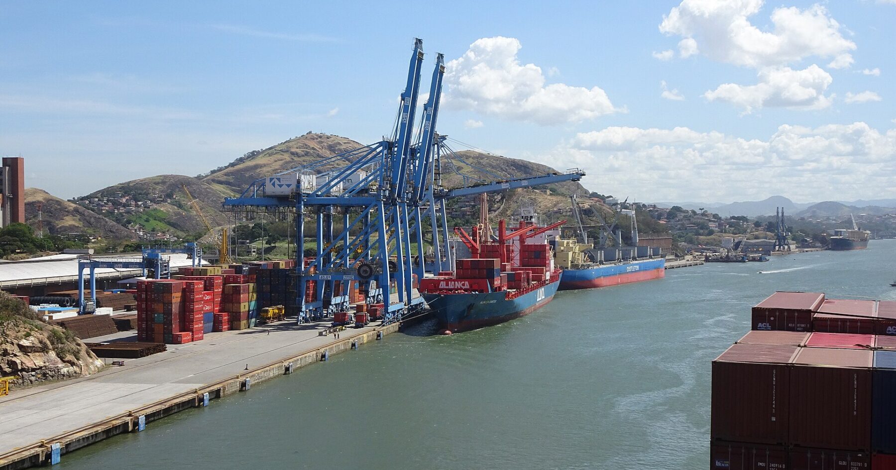 Shipping containers stacked at the Port of Santos, Brazil, as global trade routes are redrawn by G7 decoupling from Chinese supply chains and US tariff policy.