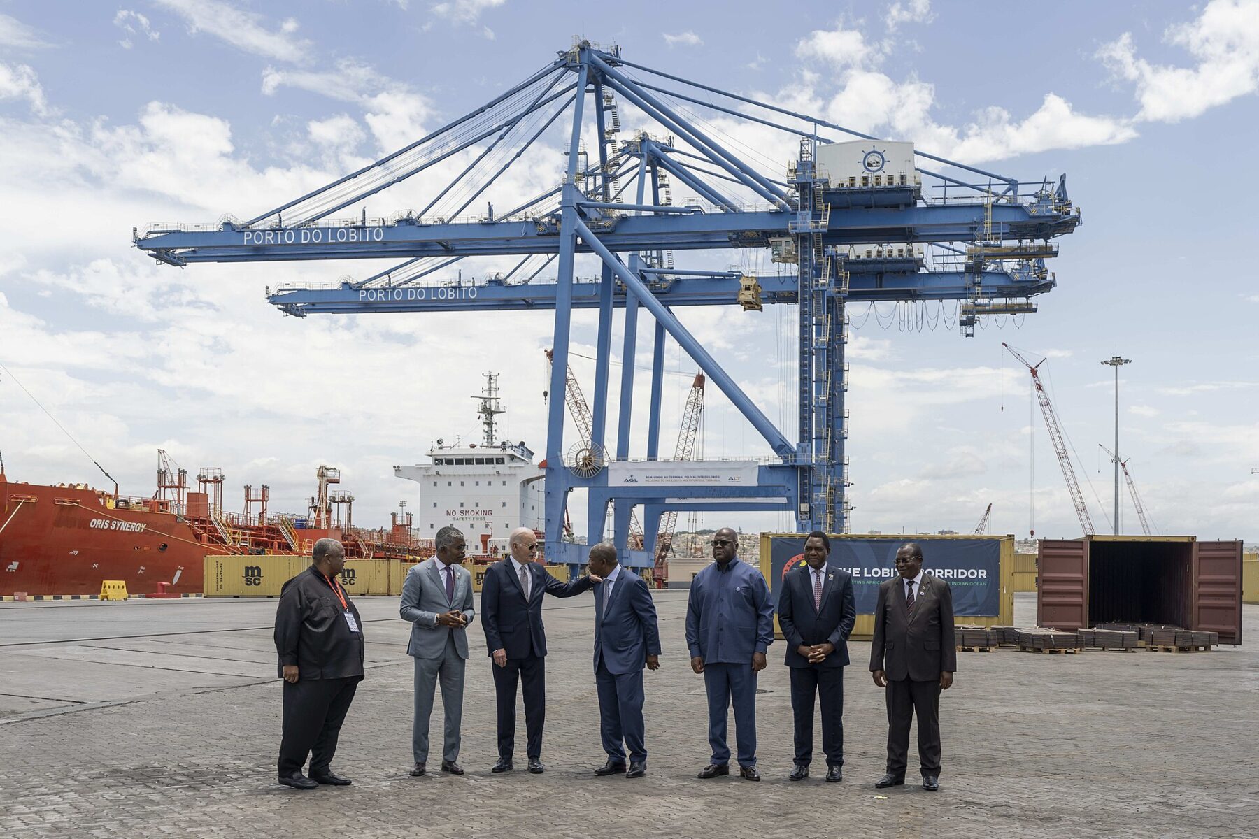 Freight wagons at an Atlantic port terminal in Angola, representing the Lobito Corridor mineral railway.