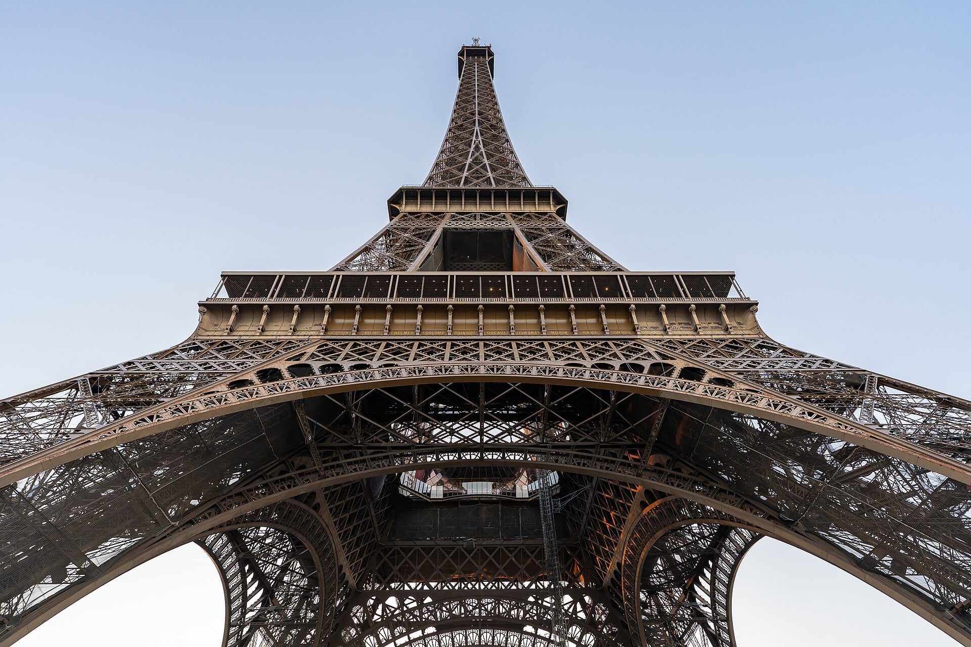 People seeking shade near the Eiffel Tower in Paris during a record European heatwave.
