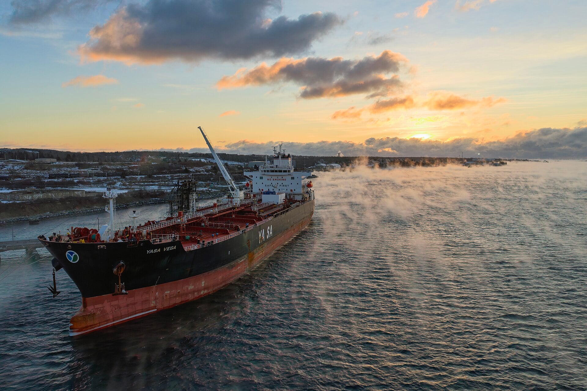 An oil tanker transits the narrow waters of the Strait of Hormuz near the Musandam Peninsula.