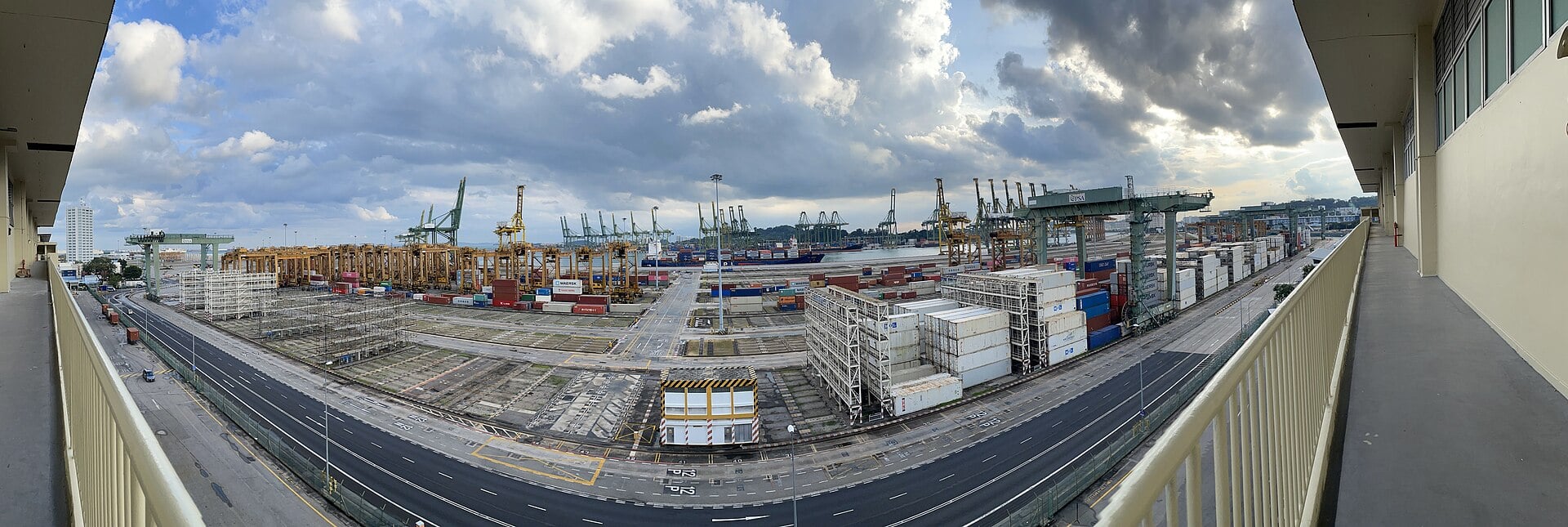 Container cranes and stacked shipping containers at a North American port handling cross-border trade.