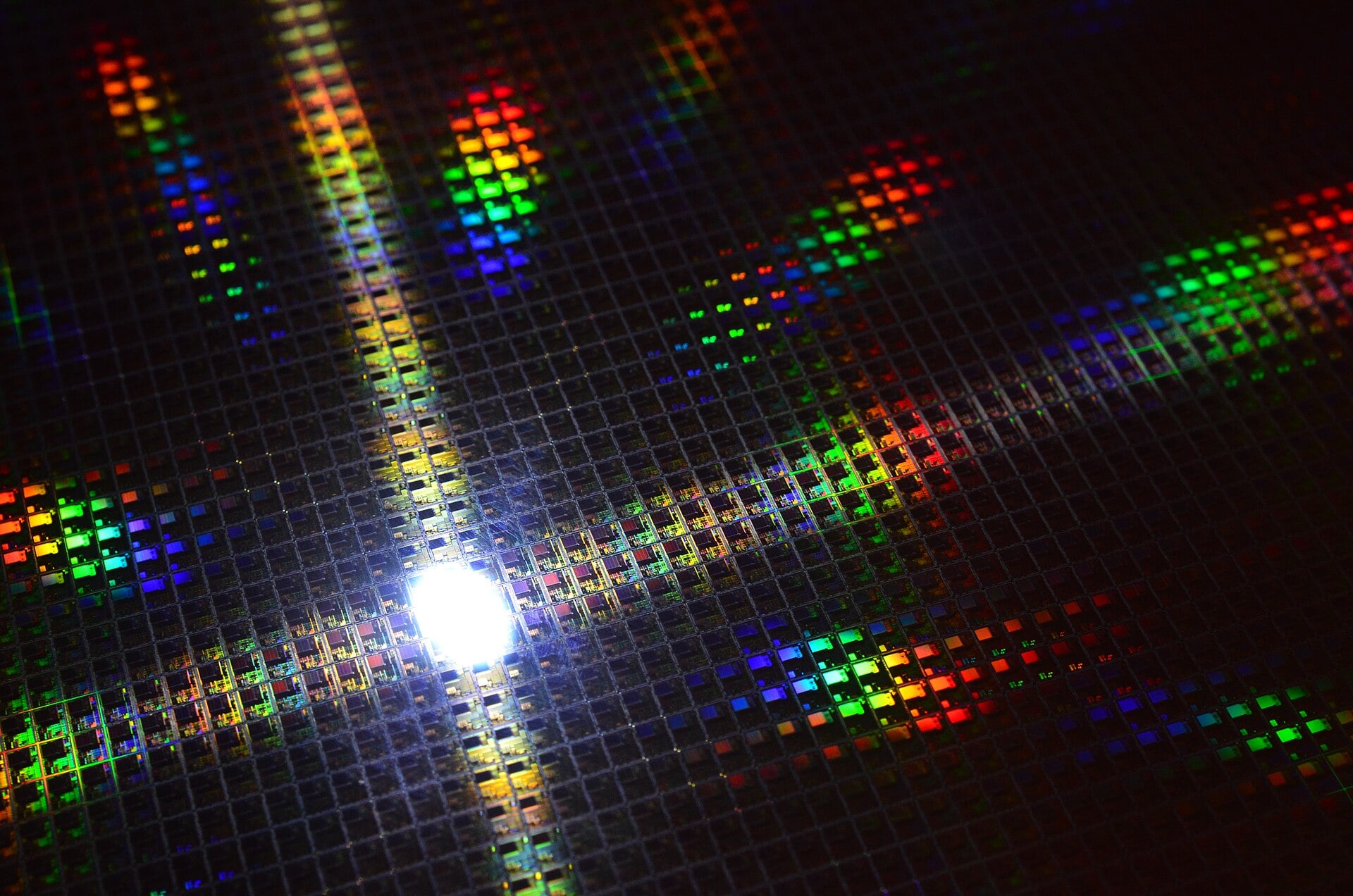 A silicon semiconductor wafer on a memory-chip production line, symbol of the global AI hardware boom.