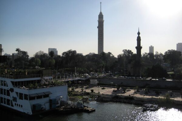 Cairo's densely populated Nile riverbank at sunset, illustrating North Africa's extreme concentration of population and water stress, a development pattern with urgent lessons for Latin America.