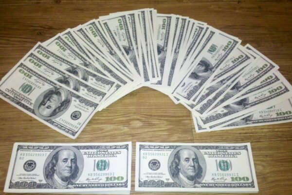 A fan of US one-hundred-dollar bills