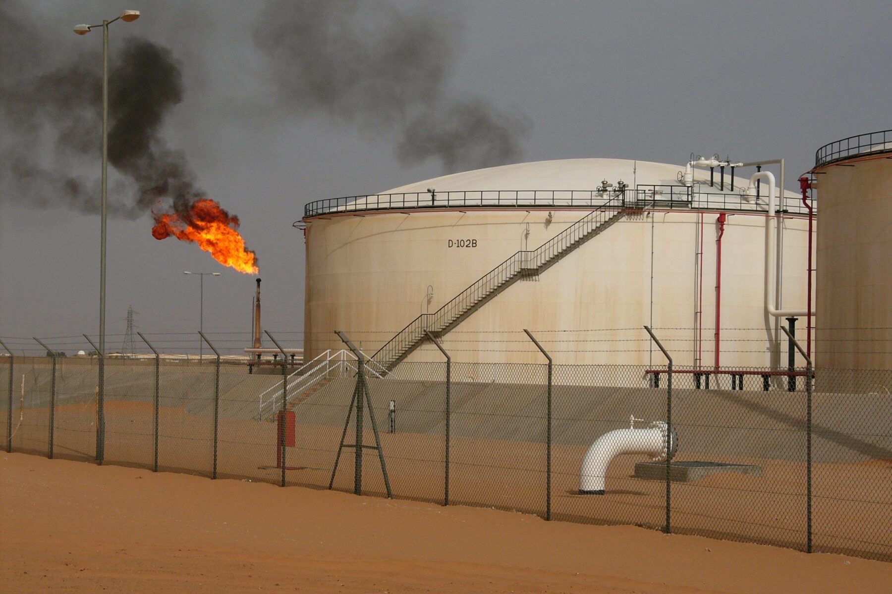 Libya oil production — El Sharara oil field tanks and gas flare