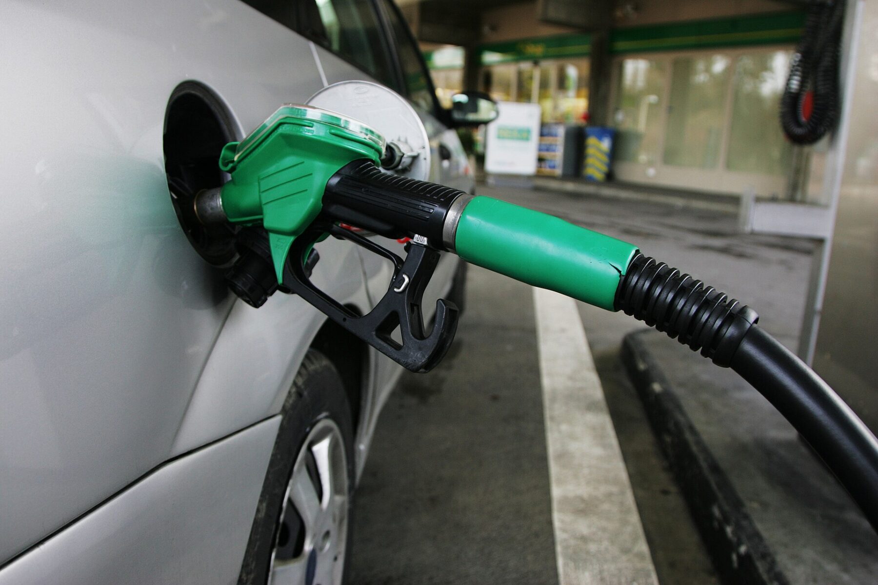Fuel pump nozzles at a petrol station, Rio fuel station laundering