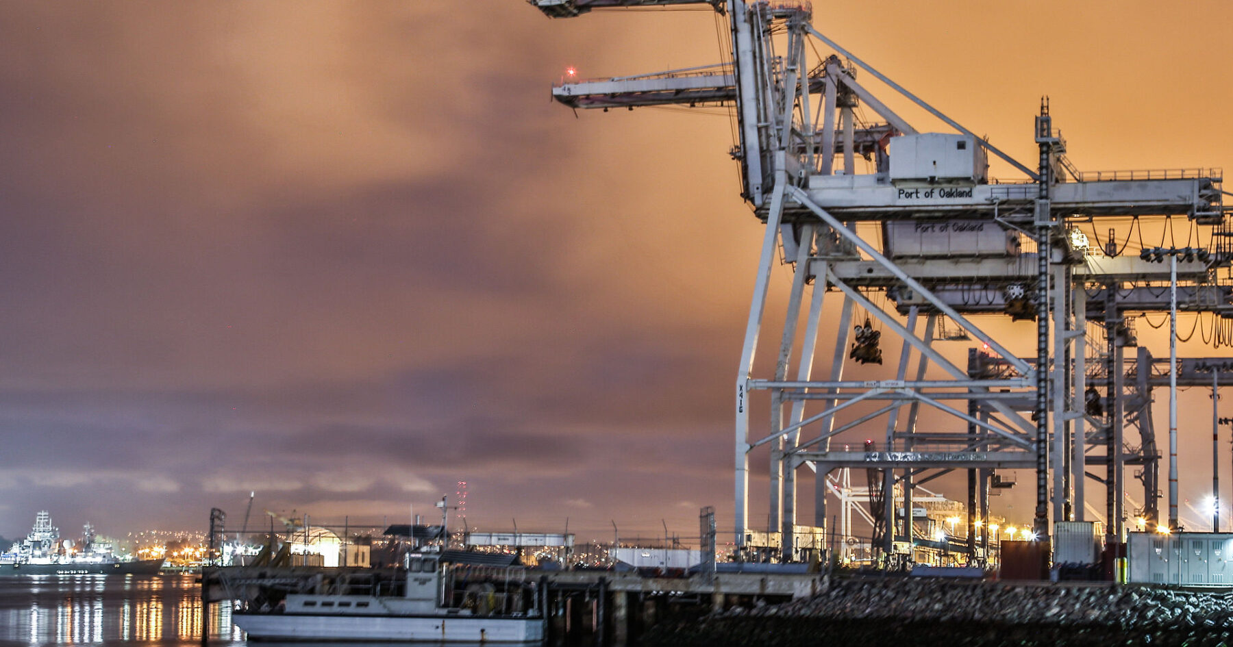 container port and cranes at sunrise