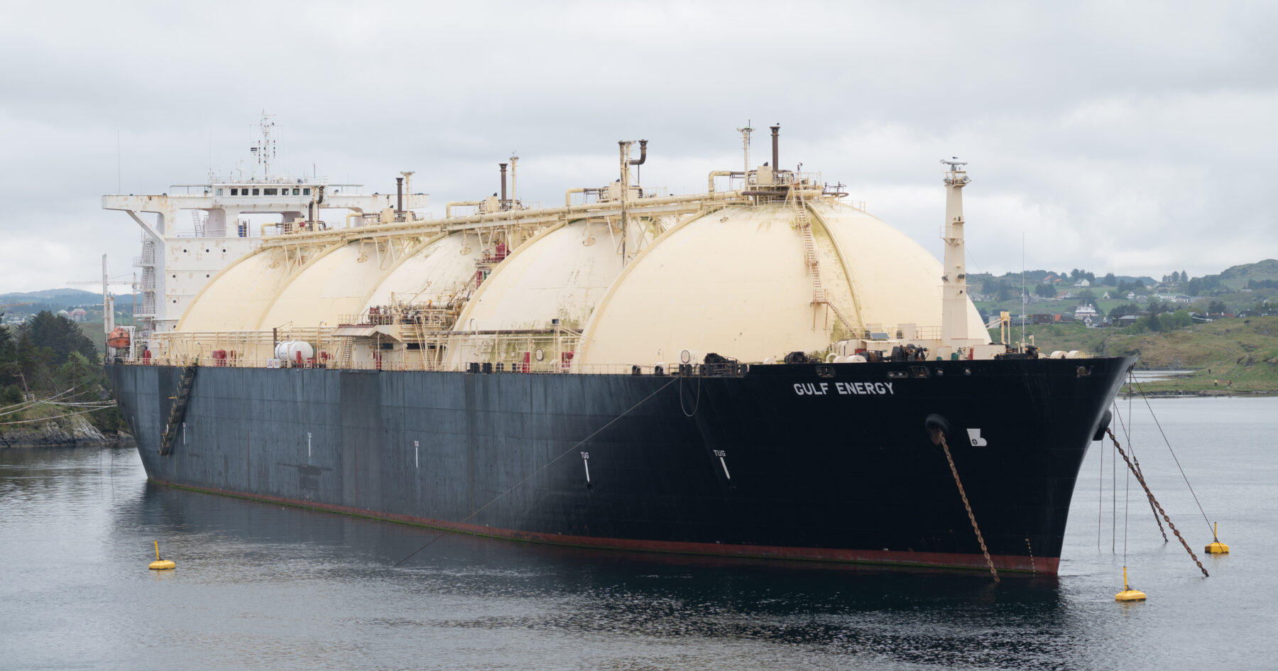 An LNG tanker moored in a harbour
