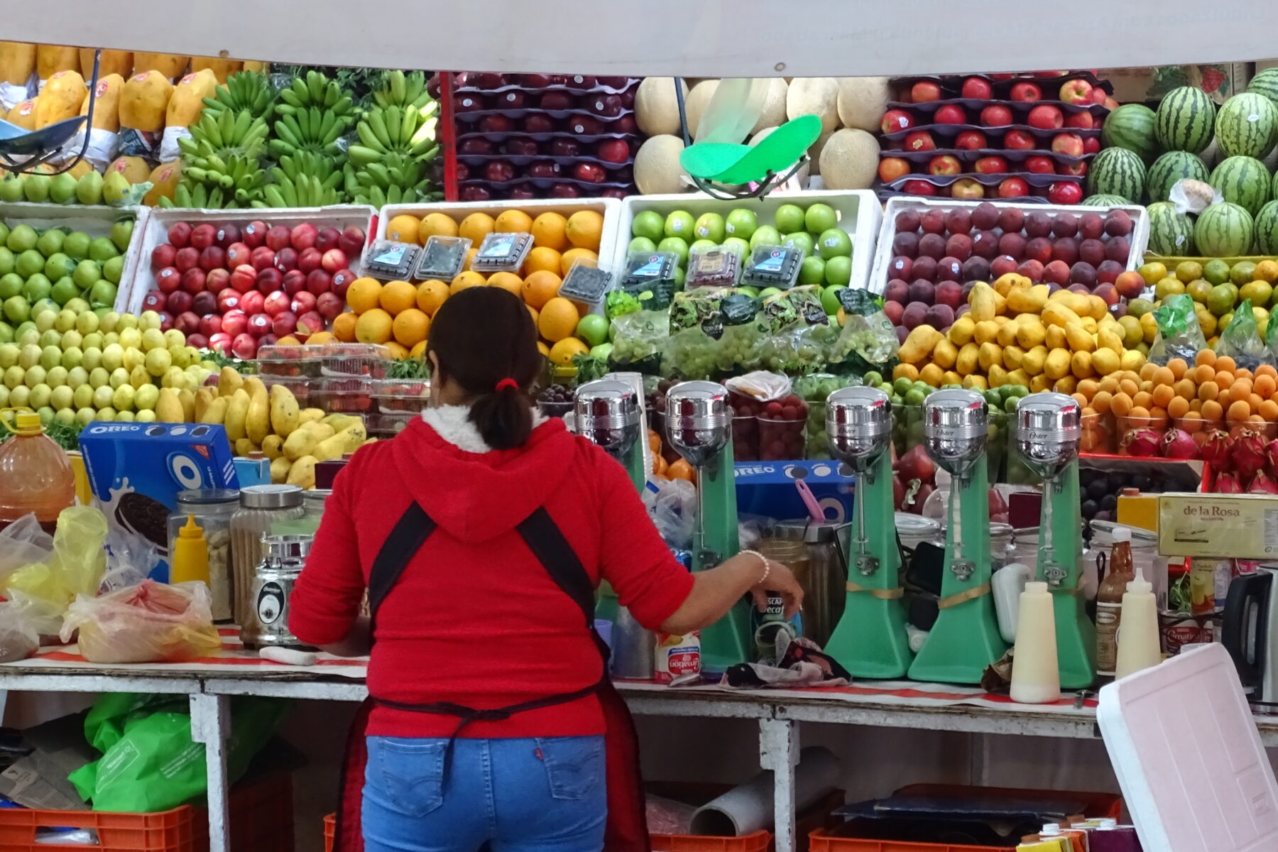 Woman vendor at a fruit stall in a Mexico City market