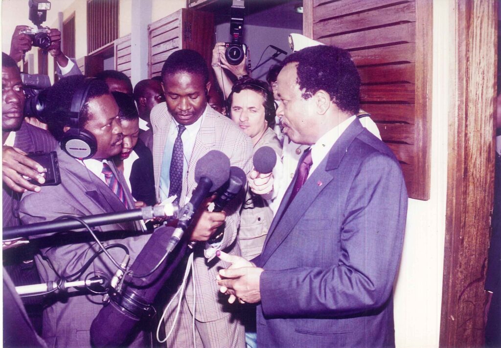 Paul Biya speaking to press with microphones