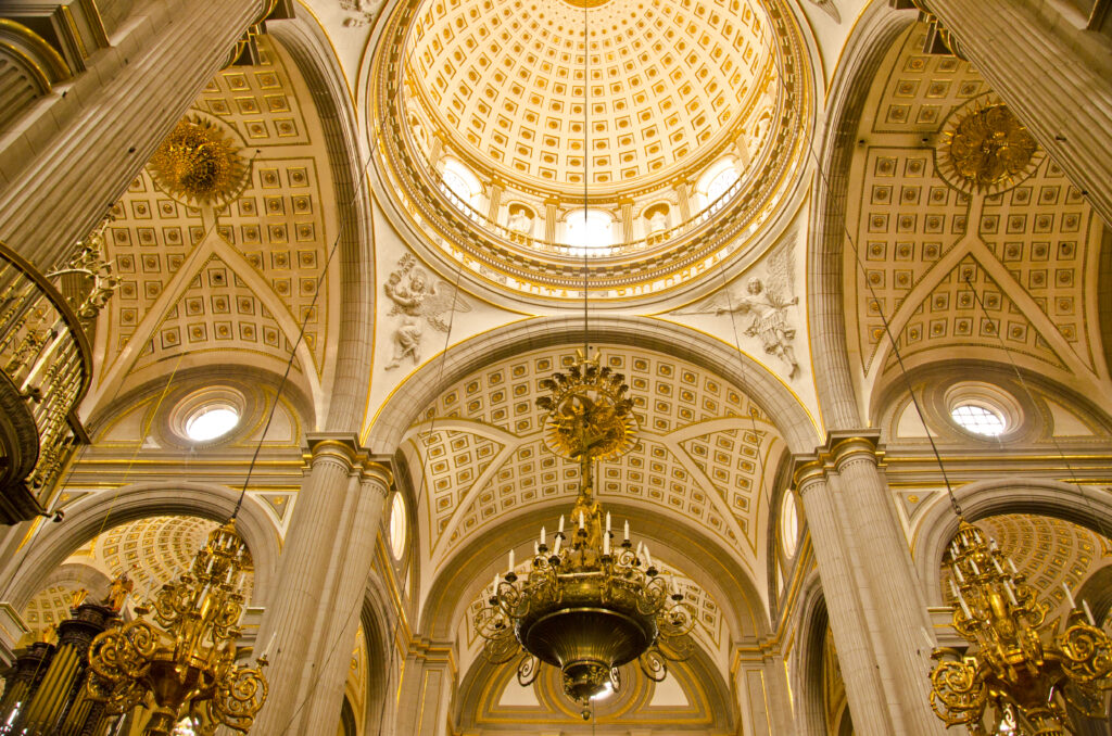 Golden dome and chandeliers inside Puebla Cathedral