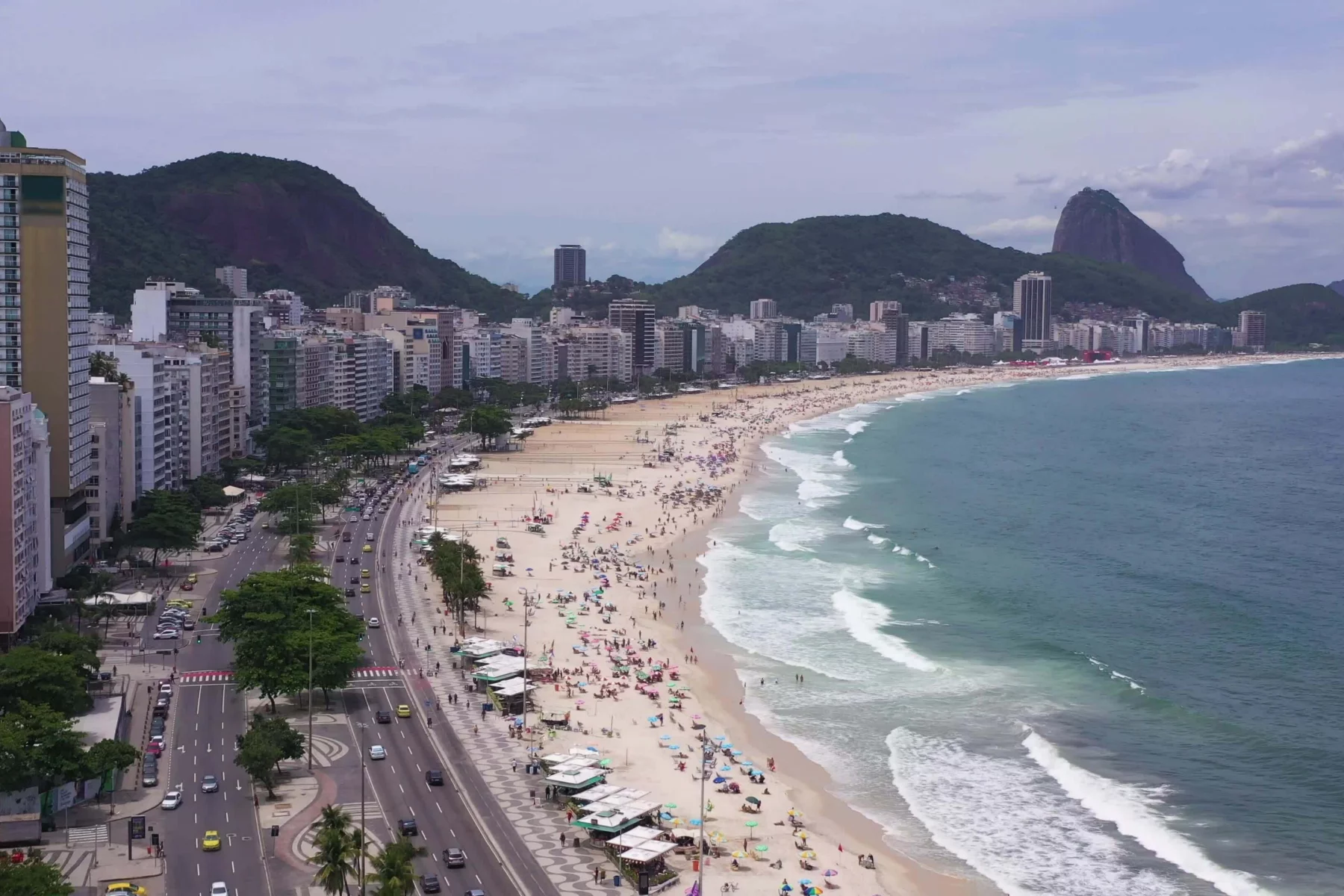 rio-de-janeiro-city-on-sunny-day-copacabana-beach-and-atlantic-ocean-aerial-view-brazil-drone-flies-forward-over-avenida-atlantica-video