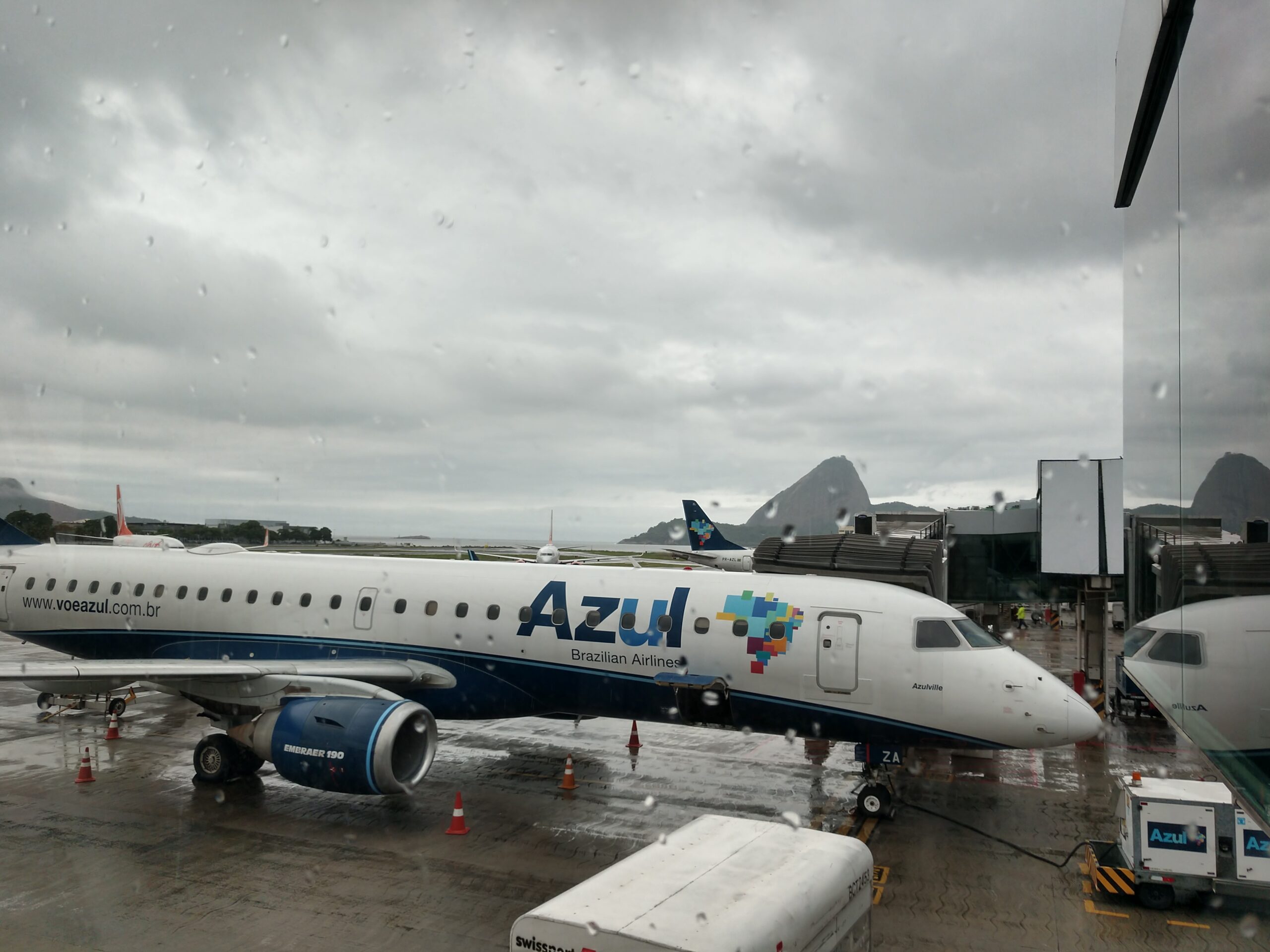 An Azul Brazilian Airlines aircraft parked at an airport gate