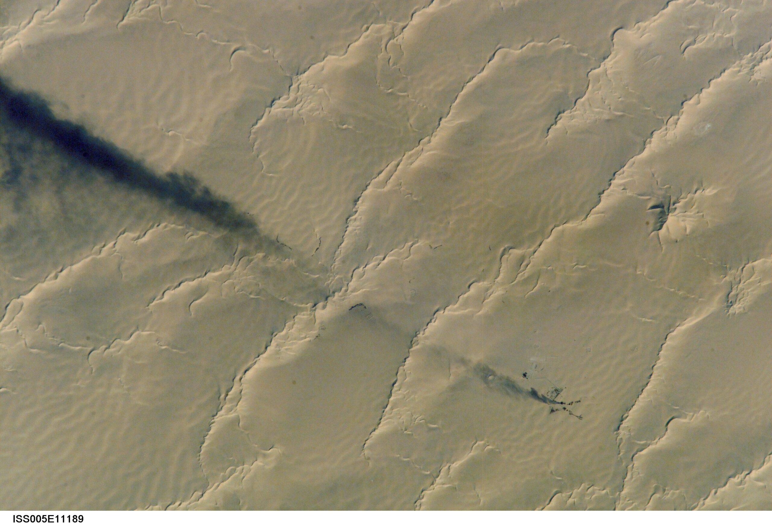 Libya gas exports — smoke from gas flares over the Calanscio Sand Sea, northeast Libya, seen from the International Space Station
