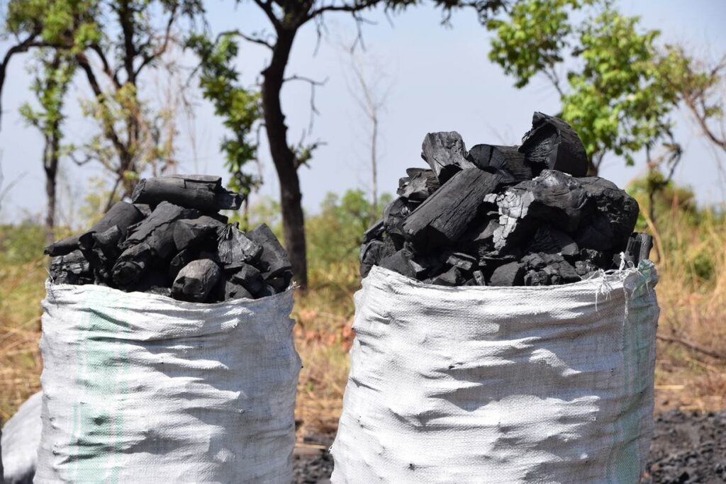 Kenya charcoal prices - artisans making charcoal cooking stoves in Kenya