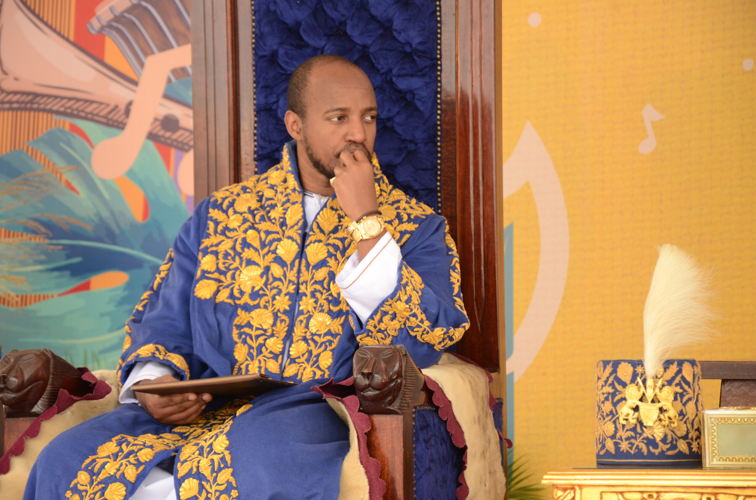 King Oyo of Tooro seated in royal regalia in western Uganda