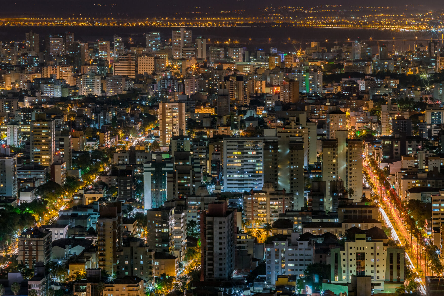 Night cityscape with many illuminated buildings and streets