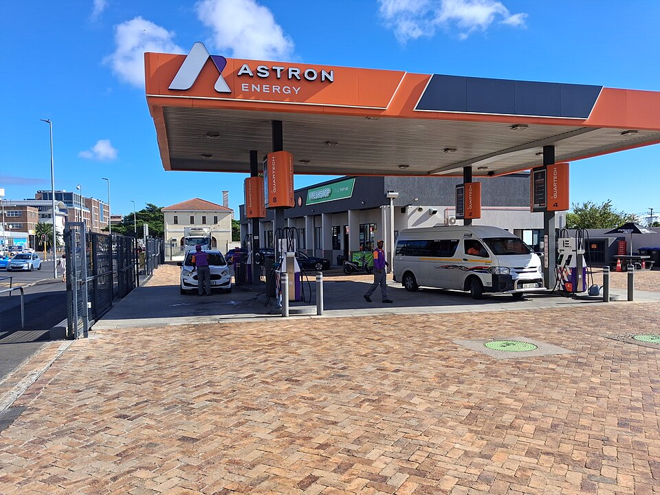 An Astron Energy petrol station in Observatory, Cape Town, with a minibus taxi at the pumps