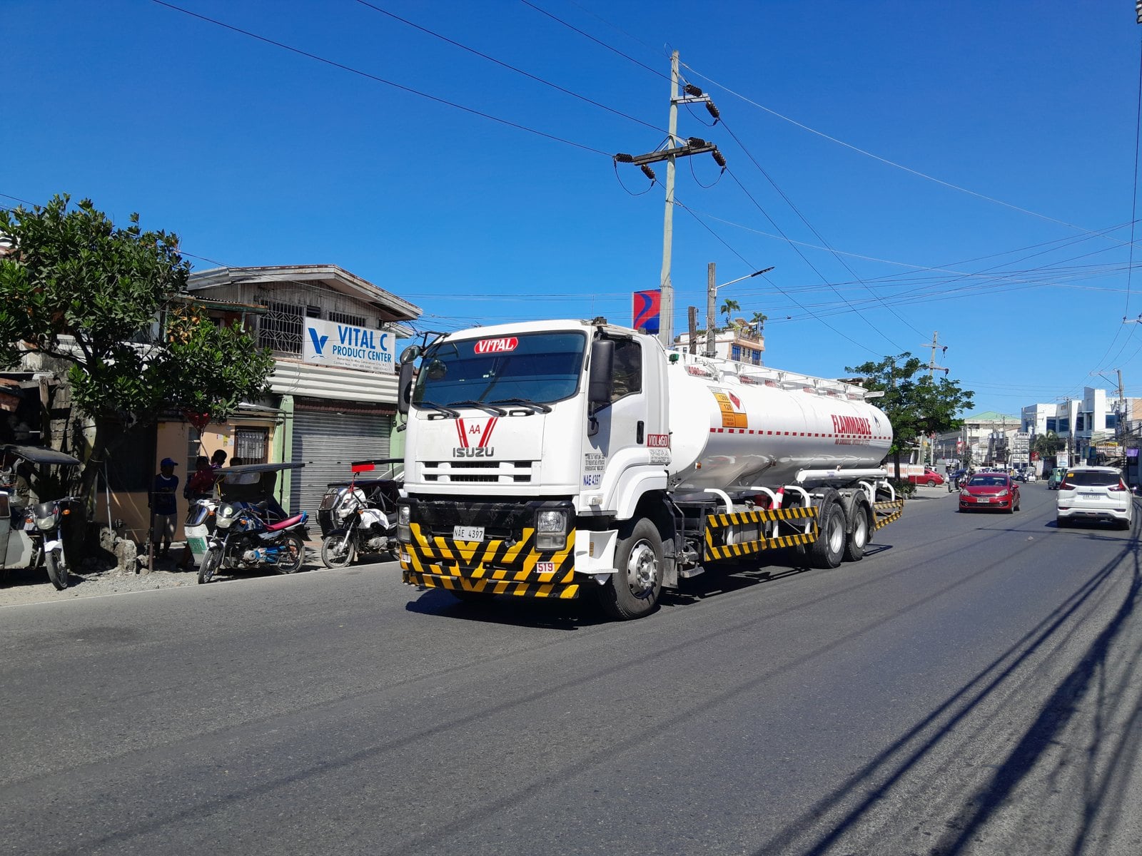A fuel tanker truck on a Latin American street.