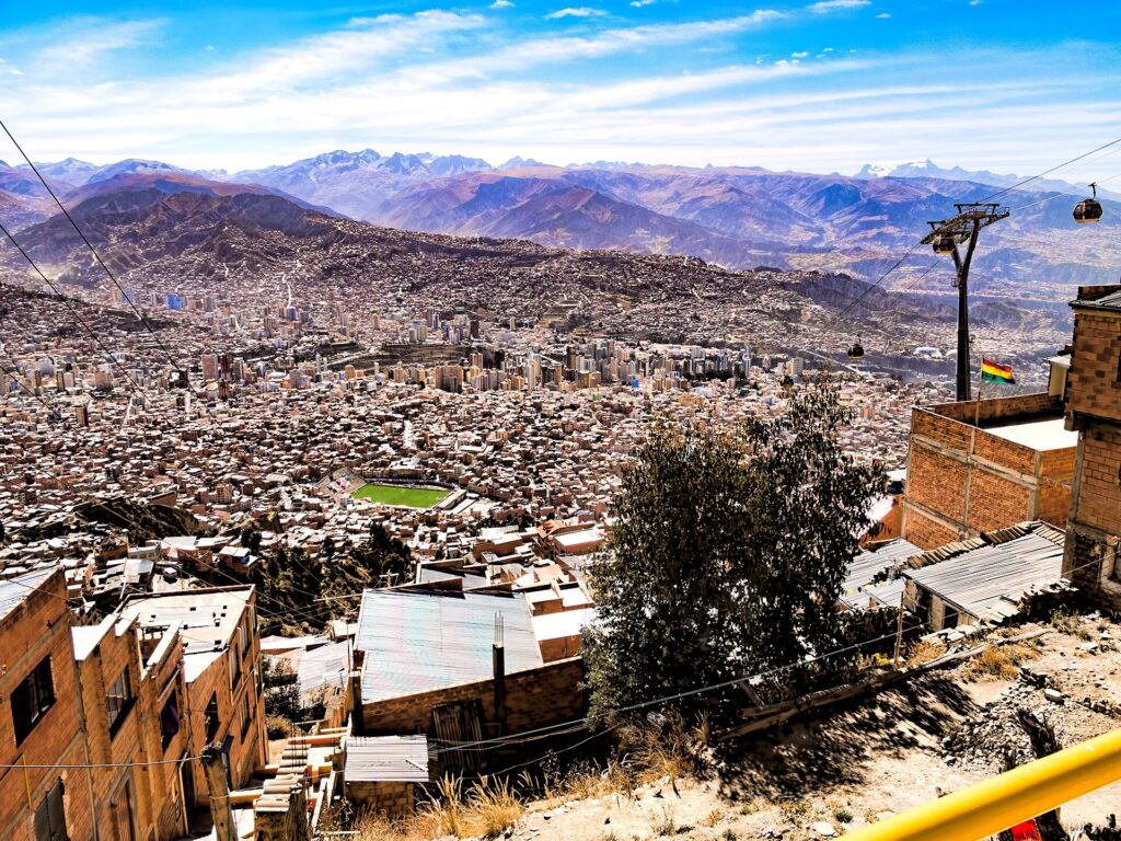Bolivian city with mountains and cable cars