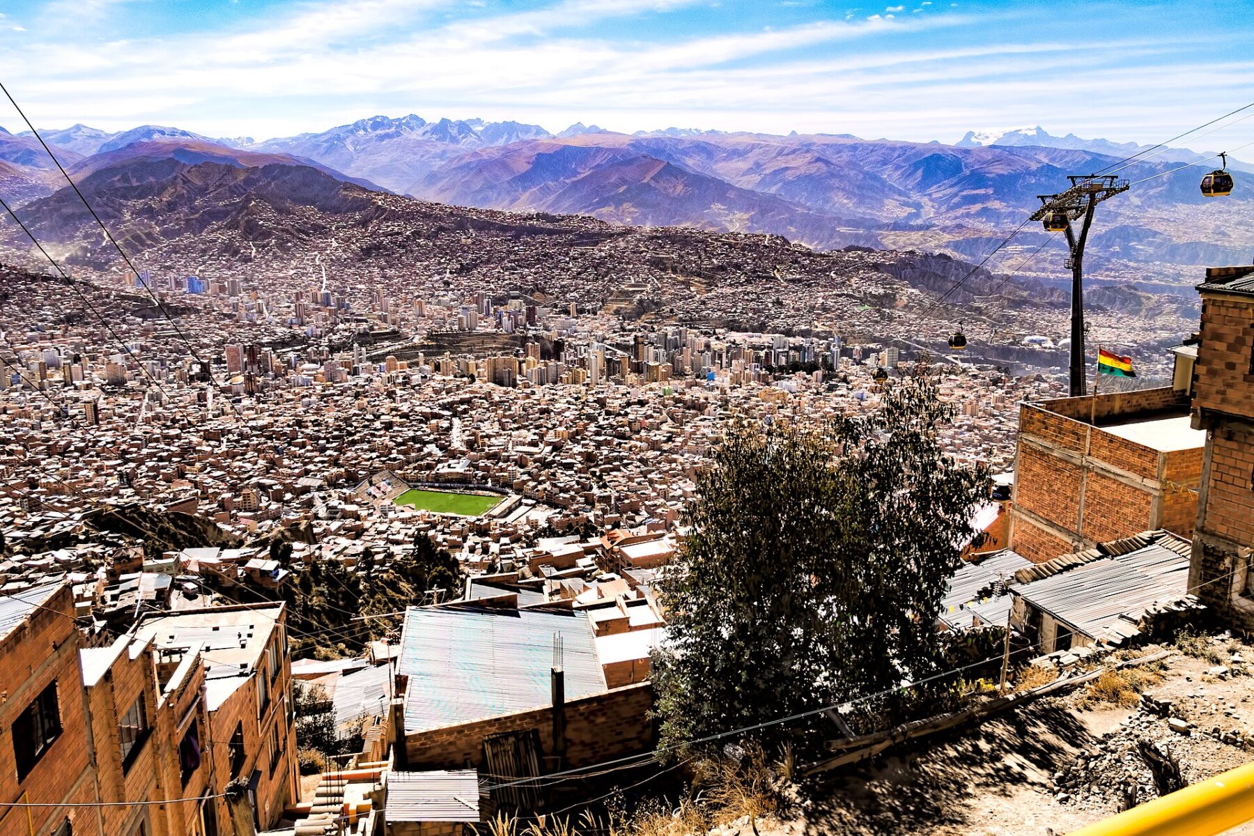 Bolivian city with mountains and cable cars