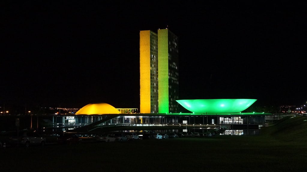 Brazil National Congress in Brasilia lit green and yellow at night
