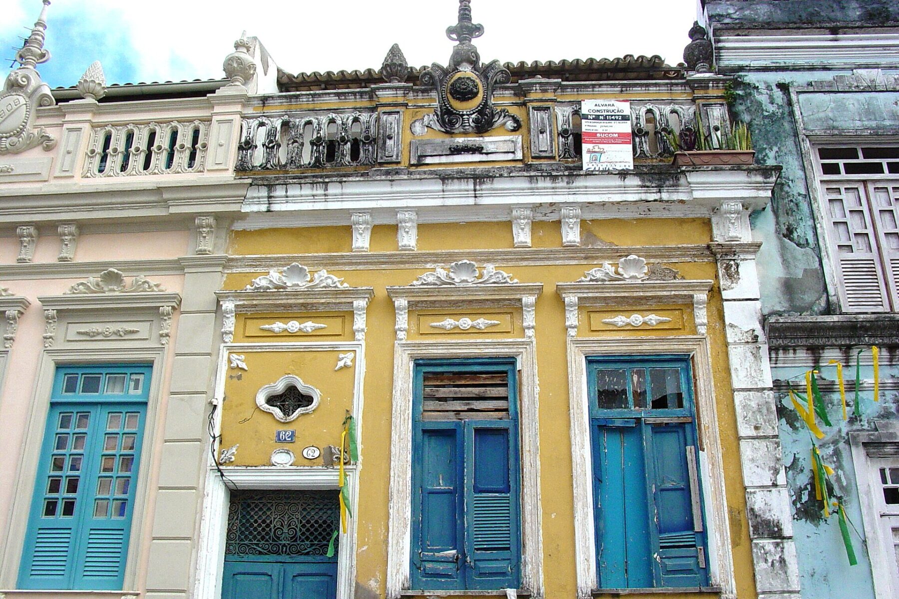 Colorful, ornate buildings with blue windows, possibly in Brazil
